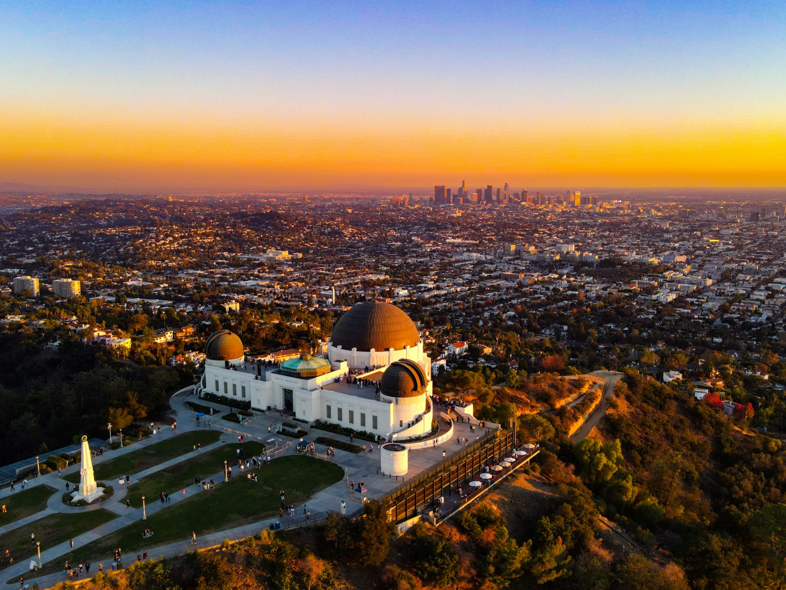 Griffith Observatory surrounded by green hills in Los Angeles